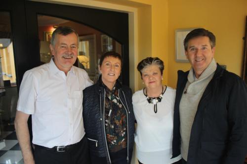 a group of three people posing for a picture at The 19th Golf Lodge in Ballybunion