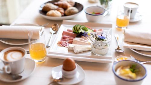 a table with a plate of food on it at Ladurner in Lagundo