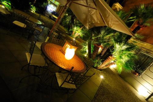 an overhead view of a table with an umbrella at Residence Villa Firenze in Alassio