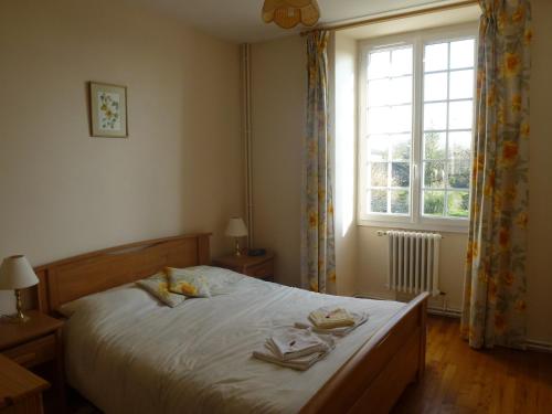 Cama o camas de una habitación en Maison Bois Fleurie
