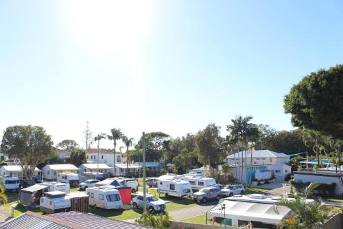 a group of rvs parked in a parking lot at Nobby Beach Holiday Village in Gold Coast