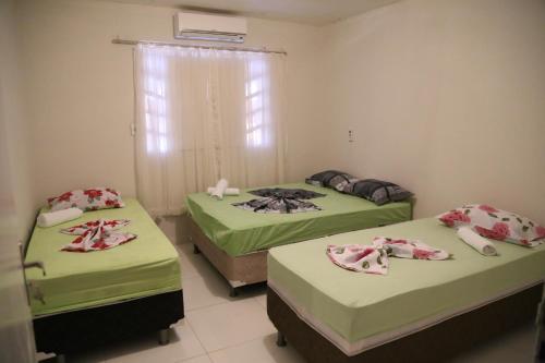 Postel nebo postele na pokoji v ubytování Casa de Temporada na Orla