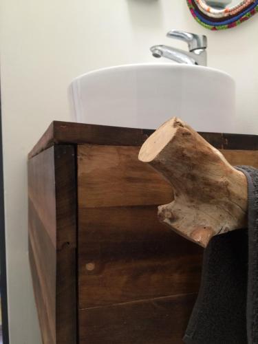 a bathroom sink with a wooden drawer next to it at Loft Alpaca in Iquique