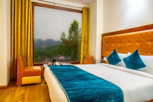 a bedroom with a large bed with a large window at Jade Vine Resort in Shogi