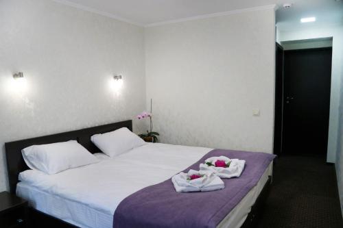 Una cama o camas en una habitación de Hotel Tourist