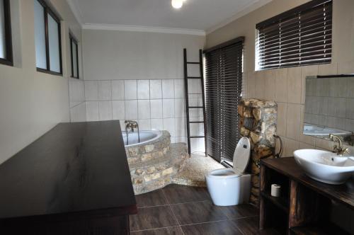 Ванная комната в Die Windpomp Guesthouse