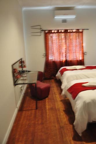 Кровать или кровати в номере Die Windpomp Guesthouse