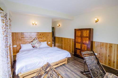 Postel nebo postele na pokoji v ubytování Aaramgah