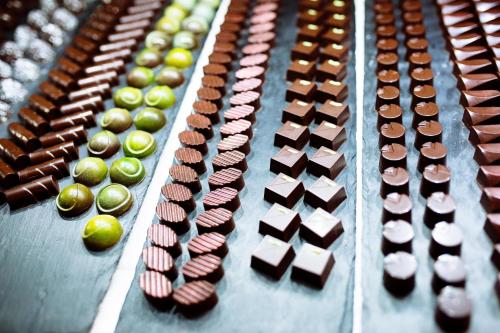 a bunch of different types ofocoluts on a table at Grand Hotel Portoroz 4* superior – Terme & Wellness LifeClass in Portorož