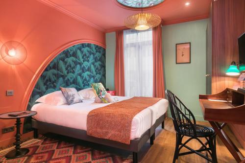 a bedroom with a bed and a piano at Villa Bougainville by Happyculture in Nice