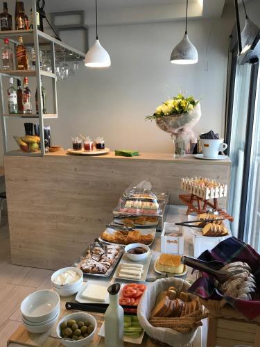 a buffet with many different types of food on a table at Mirabilia Boutique Hotel in Kriopigi