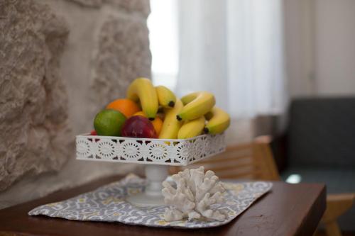 a bowl of fruit on top of a table at Studio Villa Ivka in Baška