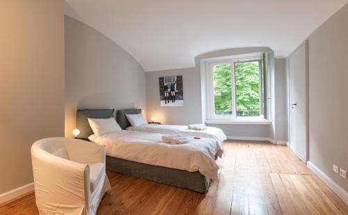 a bedroom with a large bed and a window at A due passi da tutto in Turin