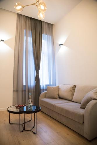 a living room with a couch and a table at Premium Apartments in Sarajevo