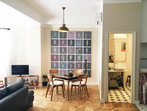 a living room with a table and chairs at Sancha de Lara in Málaga