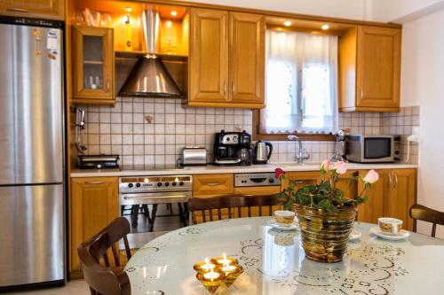 a kitchen with a table with a candle on it at Amazing Sea View Villa in Parikia