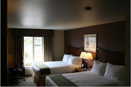 a hotel room with two beds and a window at Holiday Inn Express Hotel & Suites Willows by IHG in Willows