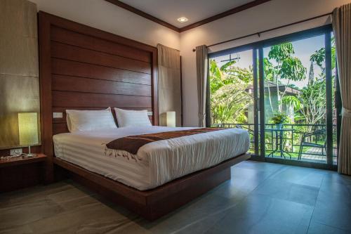 Postel nebo postele na pokoji v ubytování Baan Pinya Cosy One Bedroom Executive Bungalow