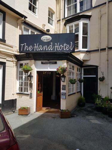 a hotel with a sign that reads the harvard hotel at The Hand Hotel in Llangollen