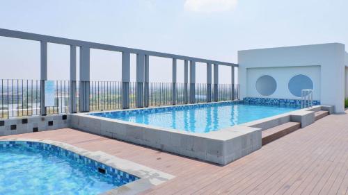 a large swimming pool on the balcony of a building at Swiss-Belinn Cikarang in Cikarang