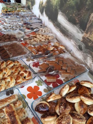 a table full of different types of pastries and desserts at Hamle Hotel in Akyaka