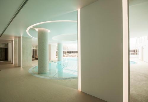 a hallway of a building with a glass floor at Hotel Alto Lido in Funchal