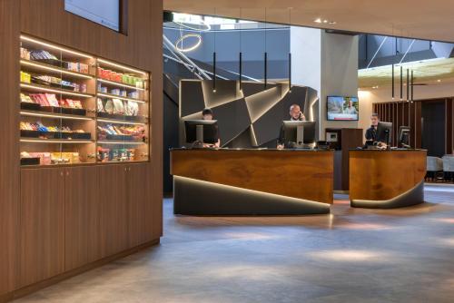 a lobby of a hotel with a reception desk at Clayton Hotel Düsseldorf City Centre in Düsseldorf