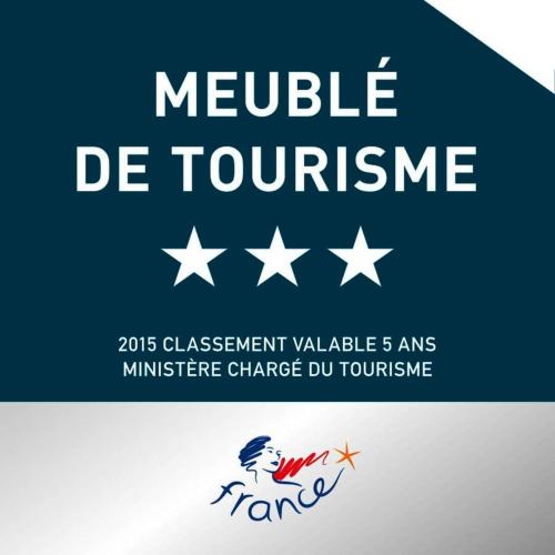 a sign that reads neville de tourism with stars at Au Cœur des Remparts in Aigues-Mortes