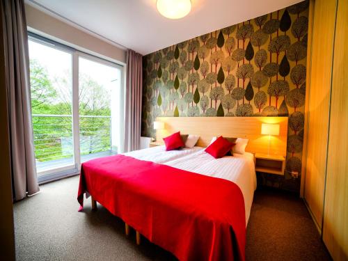 Posteľ alebo postele v izbe v ubytovaní Golden Tulip Międzyzdroje Residence