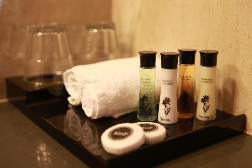 a group of four bottles of soap on a tray at Ballarat Premier Apartments in Ballarat