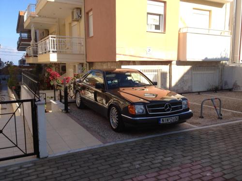 a car parked on a street next to a building at Polichrono in Polykhrono