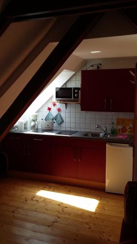 a kitchen with a sink and a stove at Ferienhaus Knappensee in Lohsa