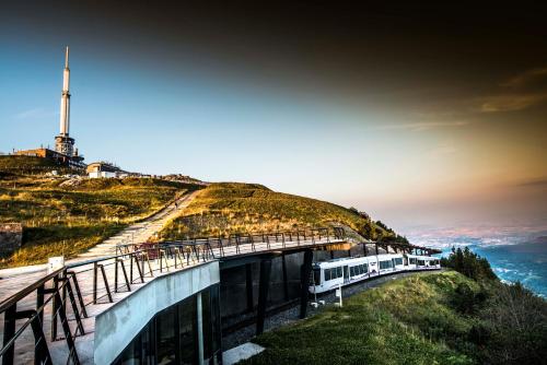 a train on a track on top of a hill at Apparthotel Privilodges Carré de Jaude in Clermont-Ferrand
