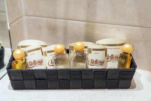 a basket filled with bottles of alcohol on a counter at Hotel Bellevue - Half Board in Pamporovo