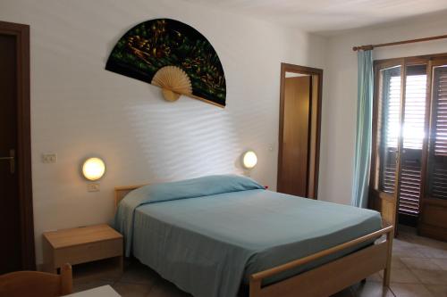 Säng eller sängar i ett rum på Residence Alithai