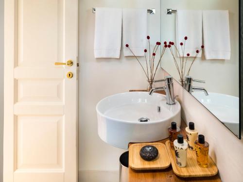 a bathroom with a sink and a mirror at Relais San Giuliano in Viagrande