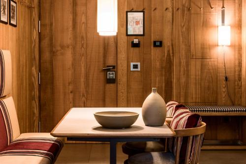 a table with a vase sitting on top of it at Eden Hotel in Bormio