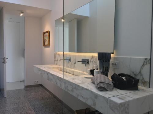a bathroom with a marble sink and a mirror at Villa Mirano in Èze
