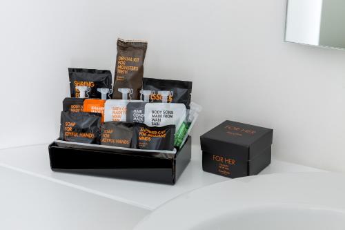 a black box next to a package of coffee at Room Mate Oscar, Madrid in Madrid