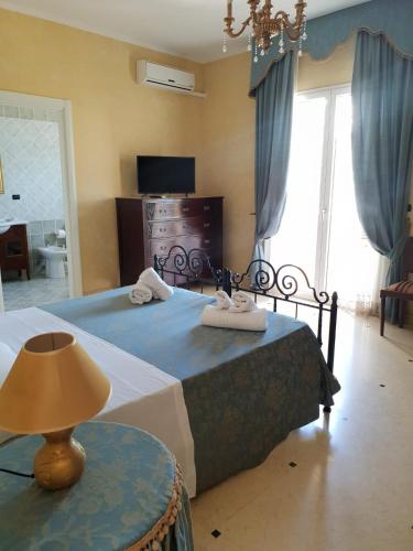 Postel nebo postele na pokoji v ubytování Villa Belvedere di Rita