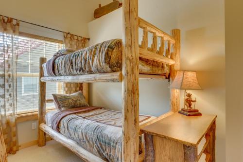 a bedroom with two bunk beds and a desk at Wild West in Government Camp