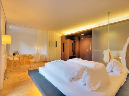 Ein Bett oder Betten in einem Zimmer der Unterkunft Hotel Hinteregger