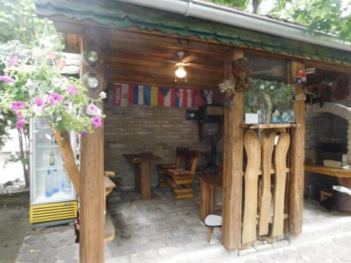 a wooden shed with a table and wooden skis at Villa Anna in Palić