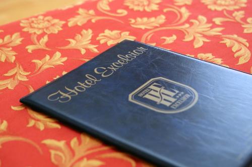 a black book sitting on top of a table at Hotel Excelsior in Monfalcone