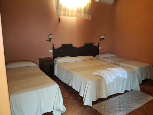 Cama o camas de una habitación en Hotel Sardus Pater