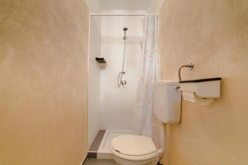 a bathroom with a toilet and a shower at Bel Soggiorno in Rimini