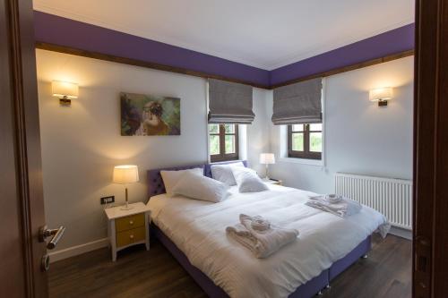 A bed or beds in a room at Abi Luxury Villas