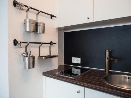 Η κουζίνα ή μικρή κουζίνα στο Kaiser Apartments