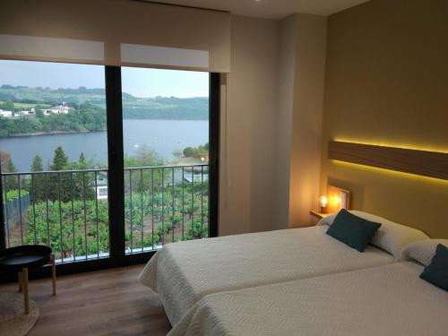 Posteľ alebo postele v izbe v ubytovaní Casona da Ponte