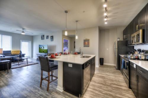 a kitchen with an island in the middle of a room at Luxury Condos by Meridian CondoResorts- Scottsdale in Scottsdale